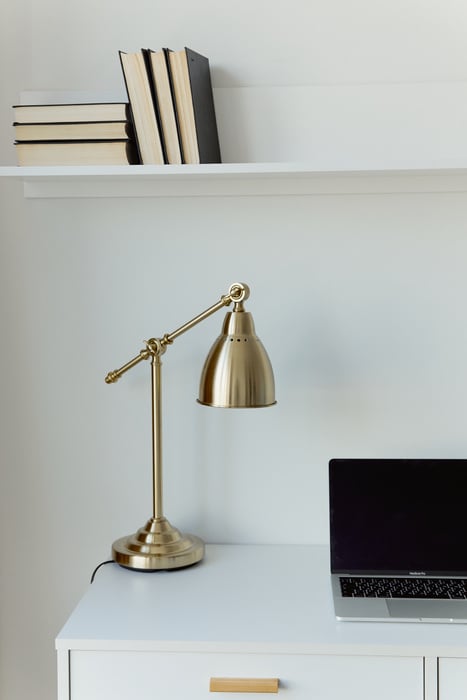 A Gold Lamp on a Table